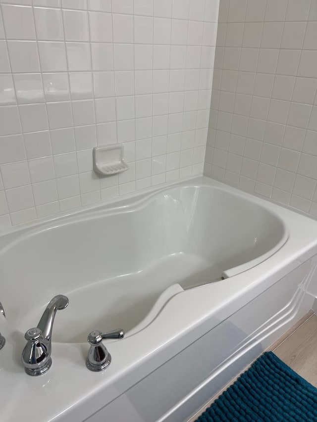 bathroom with wood-type flooring