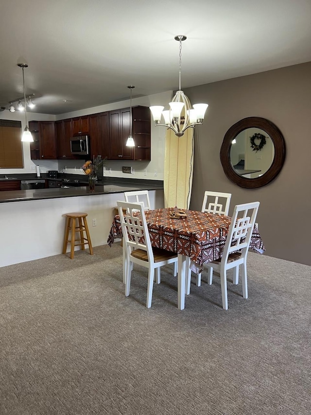 carpeted dining room with a chandelier