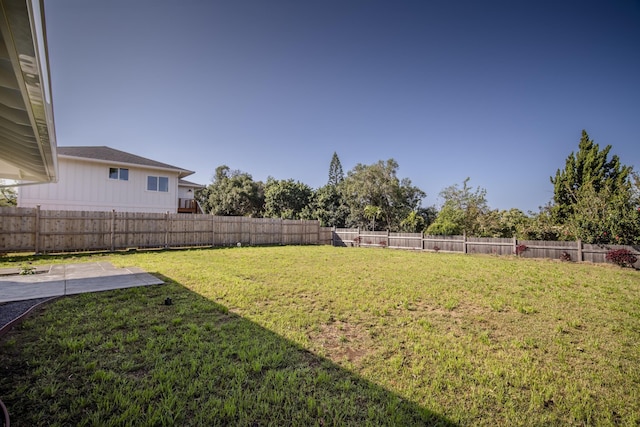 view of yard with a fenced backyard