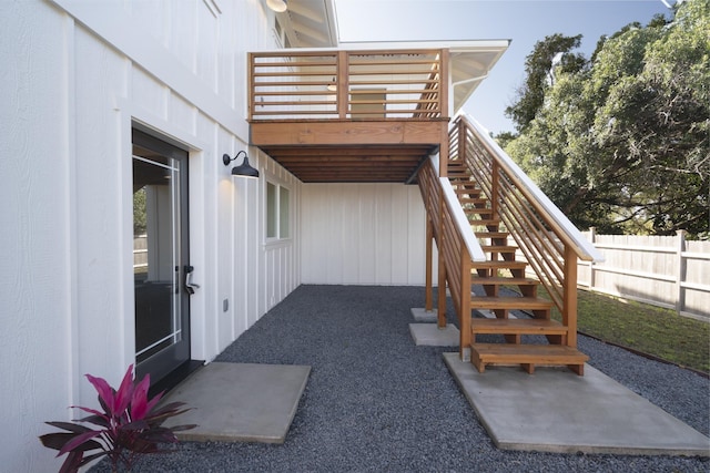 view of patio / terrace with fence and stairway