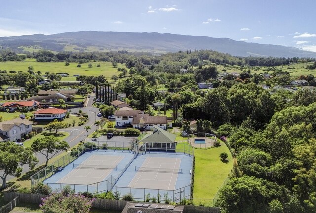 birds eye view of property with a mountain view