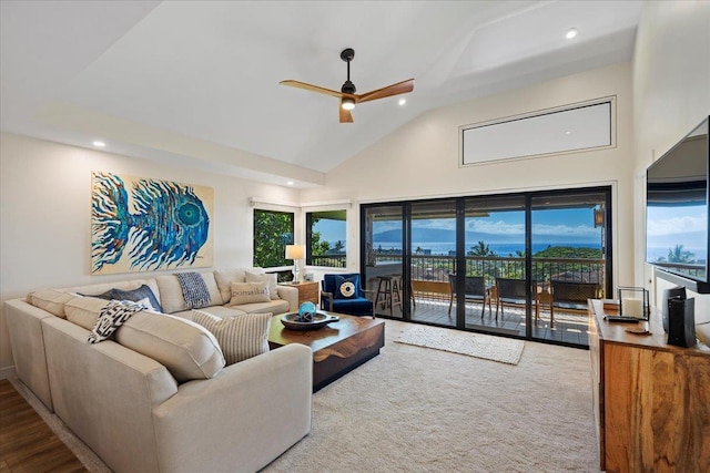 living room with recessed lighting, high vaulted ceiling, and a healthy amount of sunlight