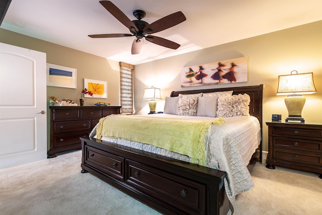 bedroom featuring ceiling fan and light colored carpet