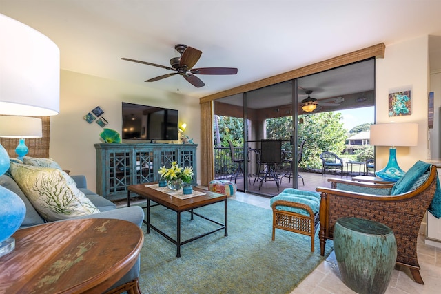 living area featuring a wall of windows and ceiling fan