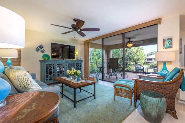 living area featuring a wall of windows and a ceiling fan