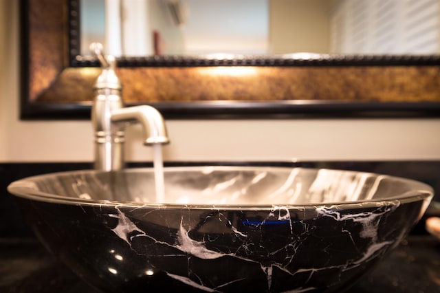 room details with a soaking tub and a sink
