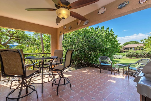view of patio / terrace featuring ceiling fan and outdoor dining space