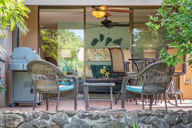 view of patio featuring ceiling fan
