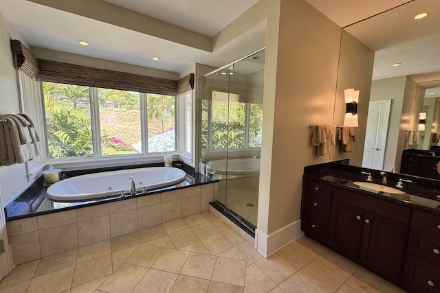 bathroom featuring a tub with jets, a shower stall, vanity, and baseboard heating