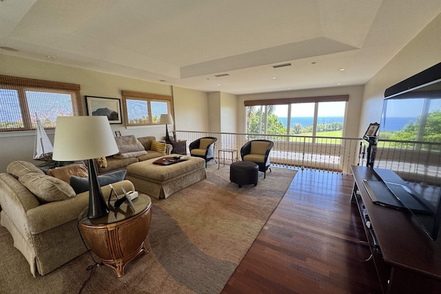 living area featuring recessed lighting, visible vents, a healthy amount of sunlight, and wood finished floors