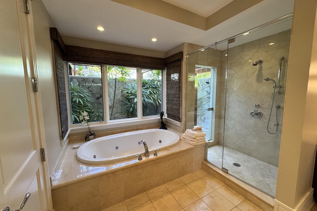 full bath featuring a jetted tub and a stall shower