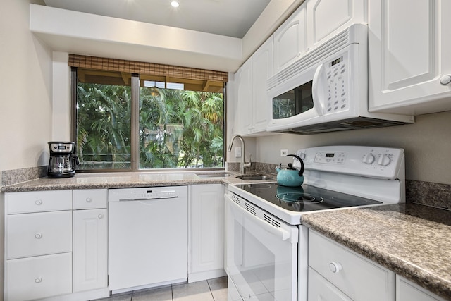 3300 Wailea Alanui Dr Unit 52D, Kihei, HI 96753 - kitchen featuring white appliances, a sink, white cabinets, and light tile patterned floors