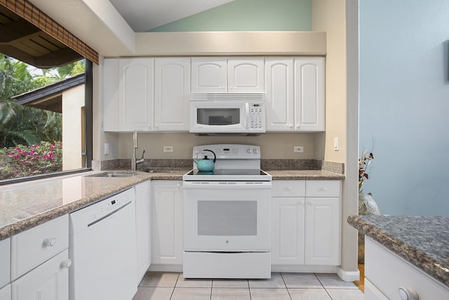 3300 Wailea Alanui Dr Unit 52D, Kihei, HI 96753 - kitchen featuring white appliances, a sink, light tile patterned floors, white cabinets, and lofted ceiling