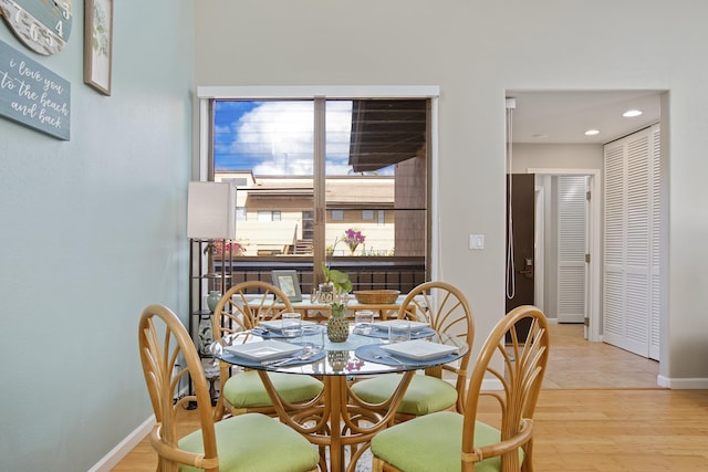 3300 Wailea Alanui Dr Unit 52D, Kihei, HI 96753 - dining space with baseboards, recessed lighting, and light wood-style floors