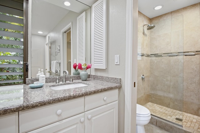 3300 Wailea Alanui Dr Unit 52D, Kihei, HI 96753 - bathroom featuring tiled shower, toilet, vanity, and recessed lighting