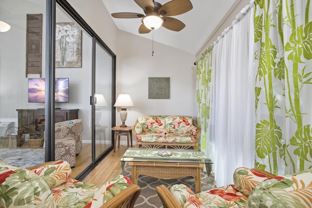 3300 Wailea Alanui Dr Unit 52D, Kihei, HI 96753 - living area featuring vaulted ceiling, wood finished floors, and a ceiling fan