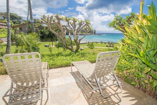 view of patio with a water view