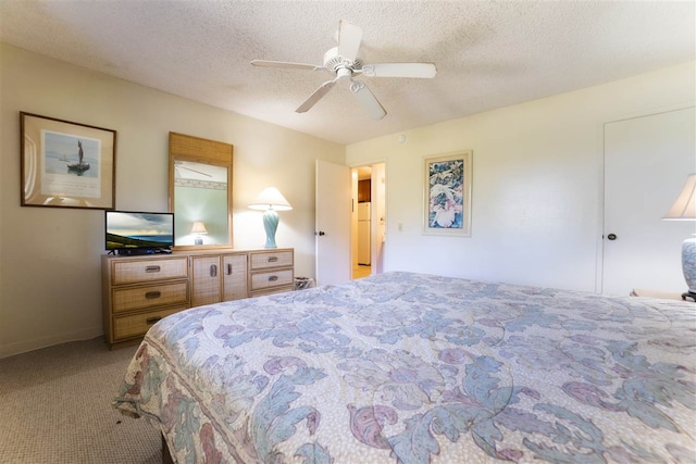 bedroom with light colored carpet, a textured ceiling, freestanding refrigerator, and ceiling fan