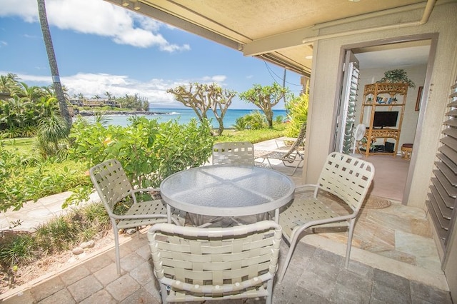 view of patio / terrace featuring outdoor dining area and a water view