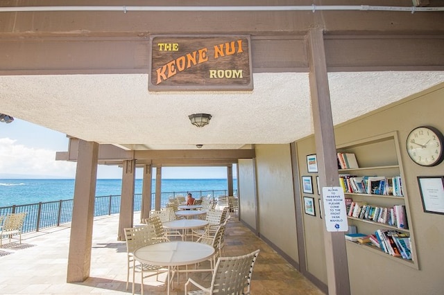 view of patio featuring a water view