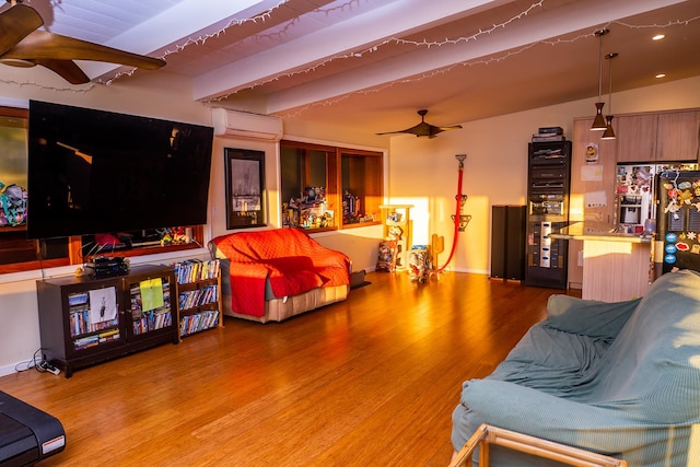 living room with a wall mounted AC, vaulted ceiling with beams, hardwood / wood-style floors, and ceiling fan