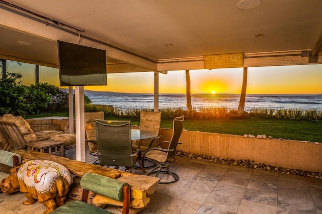 sunroom with a water view