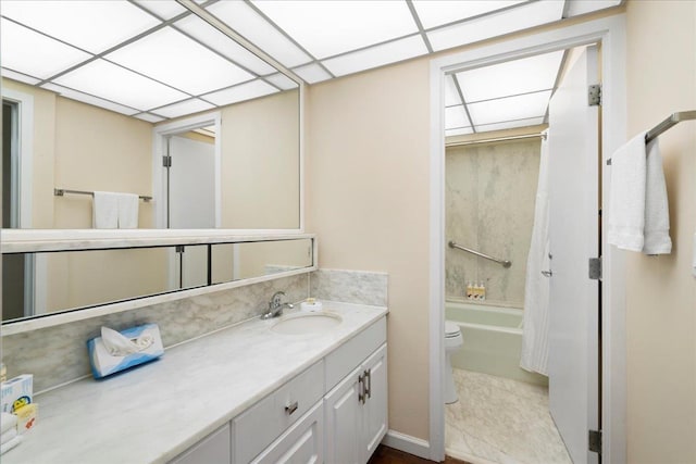 bathroom featuring shower / bath combo with shower curtain, toilet, and vanity