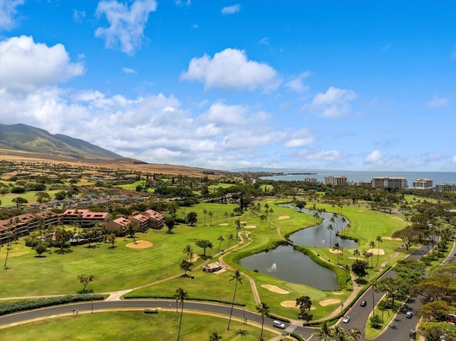 aerial view with a water and mountain view and view of golf course