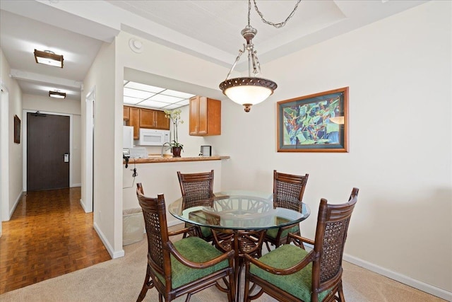 dining room featuring baseboards