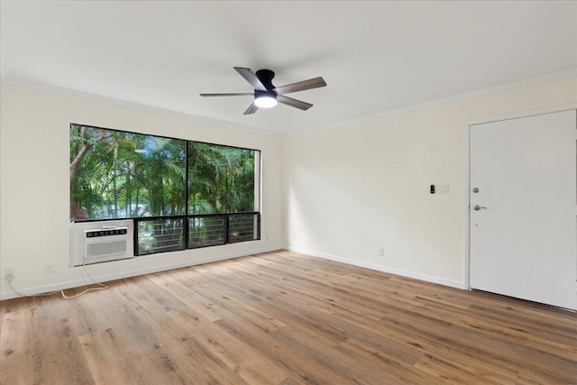 empty room featuring cooling unit, light hardwood / wood-style floors, ceiling fan, and crown molding