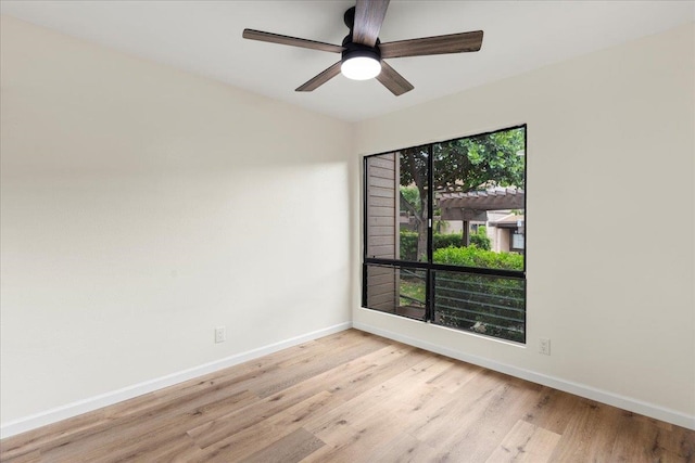 unfurnished room with light hardwood / wood-style flooring and ceiling fan