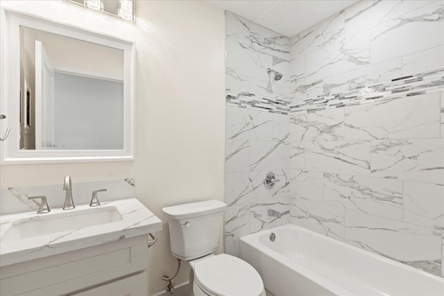 full bathroom featuring vanity, tiled shower / bath combo, and toilet