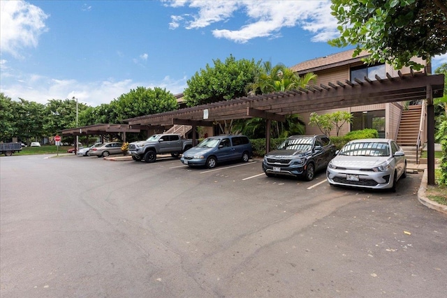 view of parking / parking lot with a carport