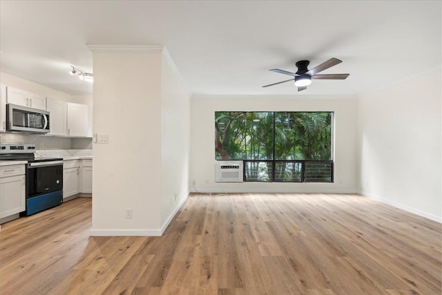 kitchen with white cabinets, light hardwood / wood-style floors, ceiling fan, and appliances with stainless steel finishes