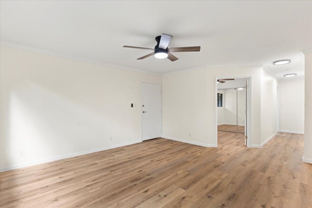 spare room featuring light hardwood / wood-style flooring, ceiling fan, and ornamental molding