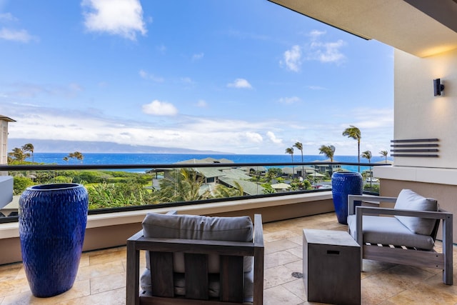 balcony featuring a water view