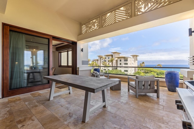 balcony featuring a water view