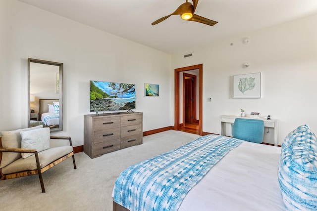 bedroom with ceiling fan and light colored carpet