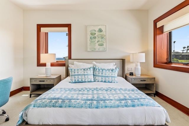 bedroom featuring light colored carpet