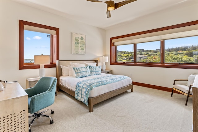 bedroom featuring ceiling fan and light colored carpet