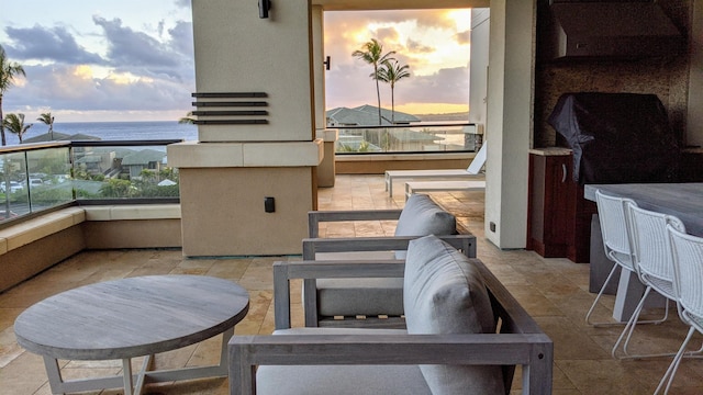 balcony at dusk with a water view