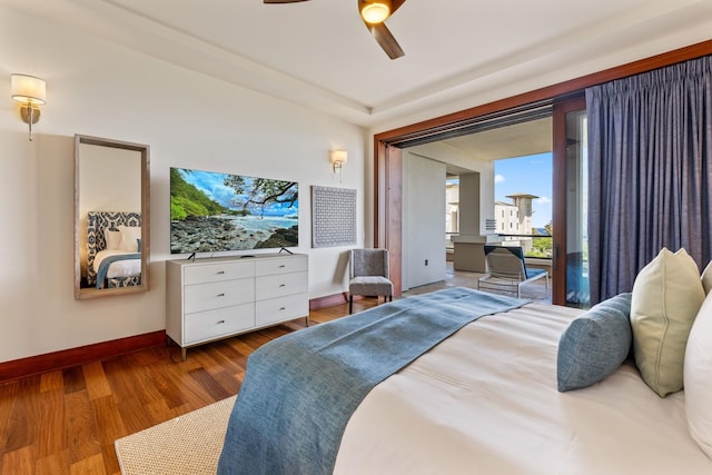 bedroom with wood-type flooring, access to outside, and ceiling fan