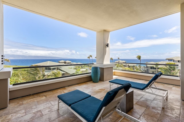 balcony featuring a water view