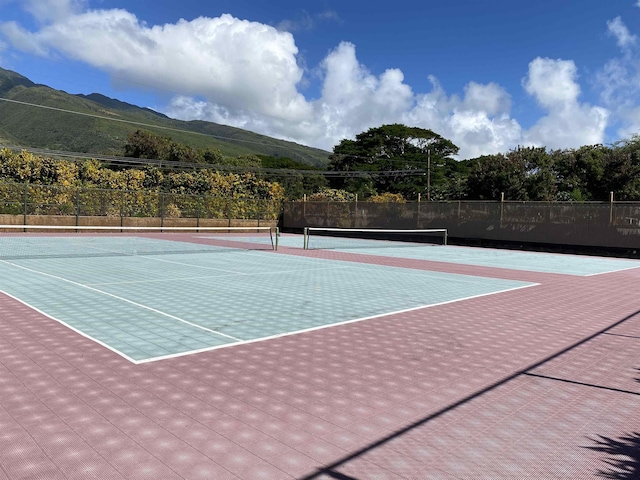 view of sport court featuring a mountain view and basketball court