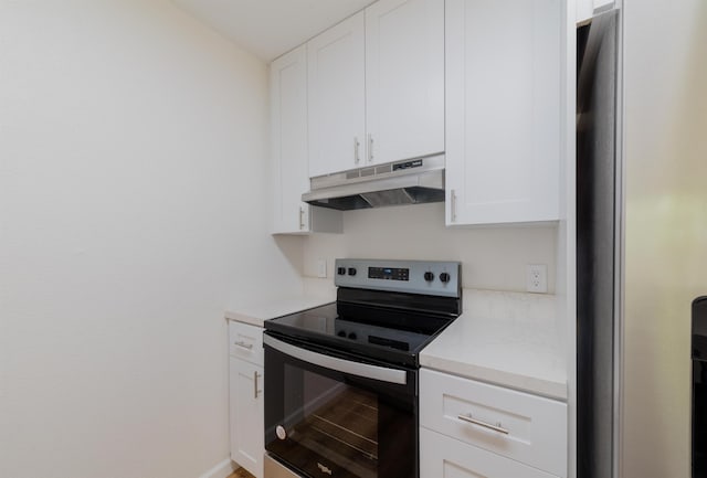 kitchen with white cabinets and appliances with stainless steel finishes