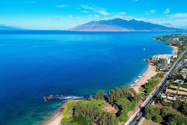 aerial view featuring a water and mountain view