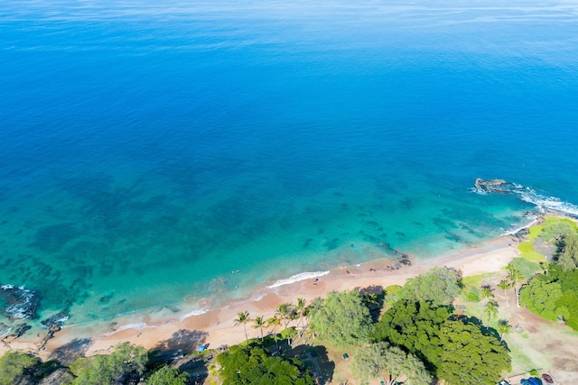 drone / aerial view featuring a view of the beach and a water view