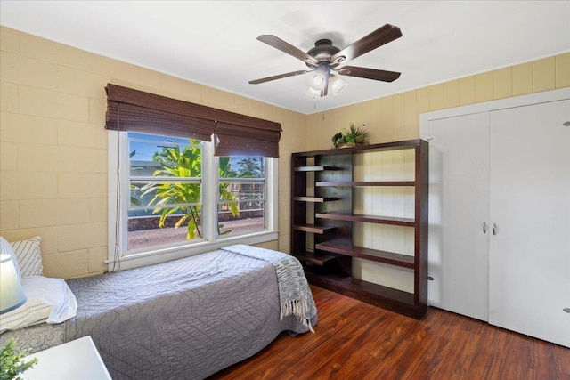 bedroom with wood finished floors and a ceiling fan