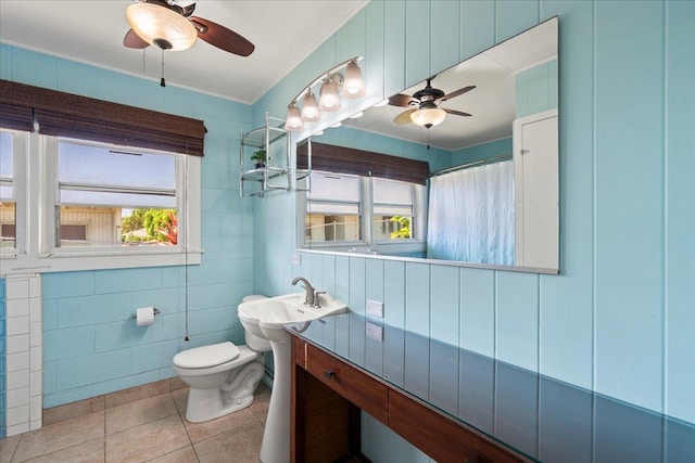 full bath with toilet, ceiling fan, and tile patterned flooring