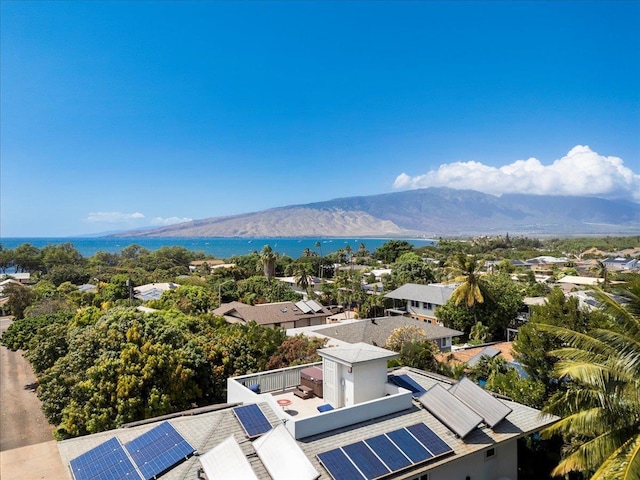 aerial view featuring a water and mountain view